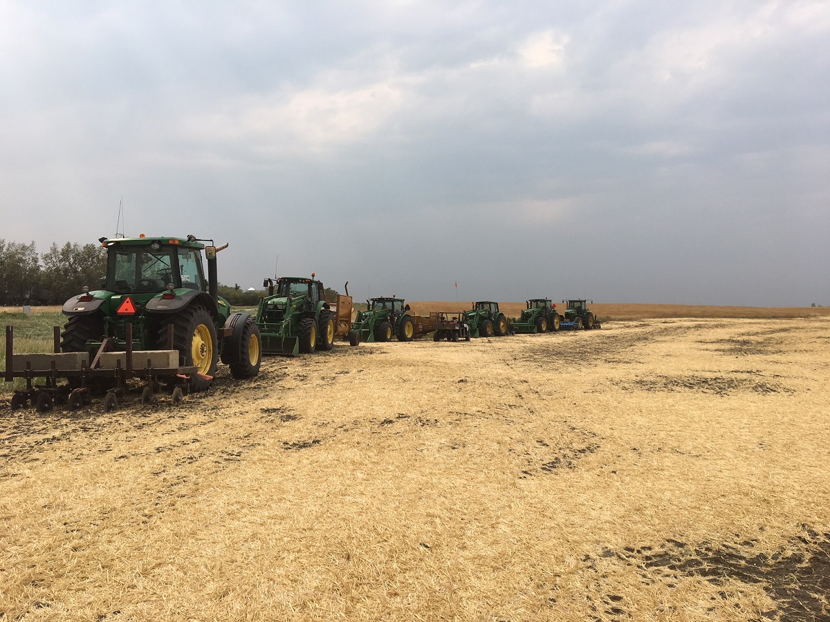 Several tractors in field